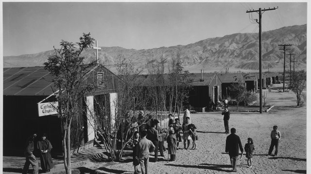 People standing outside Catholic church at Manzanar Relocation Center, California 1943