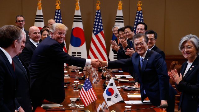 U.S. President Donald Trump, left, shakes hands with South Korean President Moon Jae-in