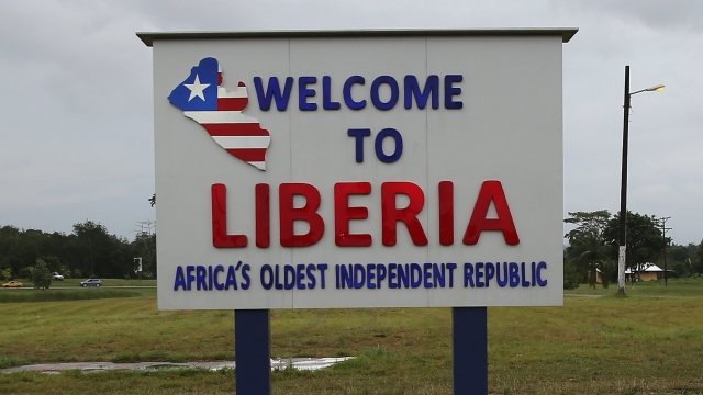 A sign welcomes visitors to Liberia at the airport near Monrovia