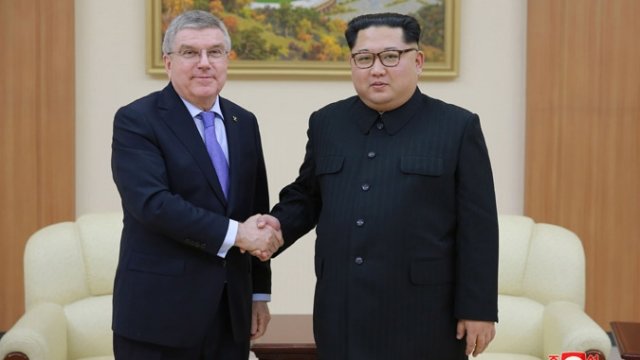 IOC President Thomas Bach, left, with North Korean leader Kim Jong-un