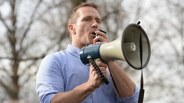 Missouri Gov. Eric Greitens holds a megaphone
