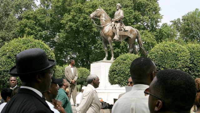 Protesters rally around a statue of Nathan Bedford Forrest in Memphis, Tennessee in 2005. That statue was removed in 2017.