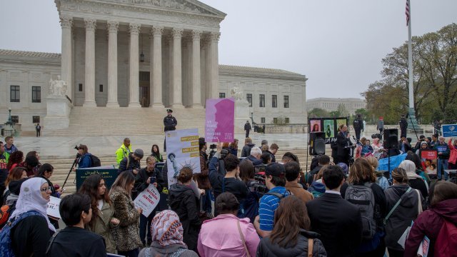 Protesters gather outside the Supreme Court