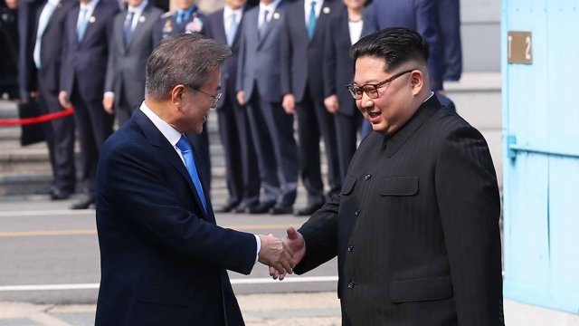 South Korean President Moon Jae-in and North Korean leader Kim Jung-un shake hands