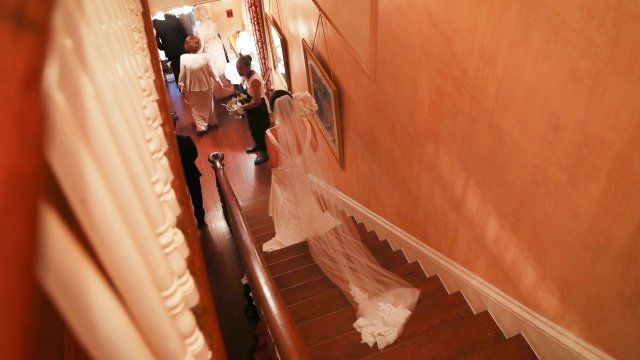 Bride Victoria Yu prepares for her wedding to Nicholas Persac at the historic Degas House in New Orleans, Louisiana.