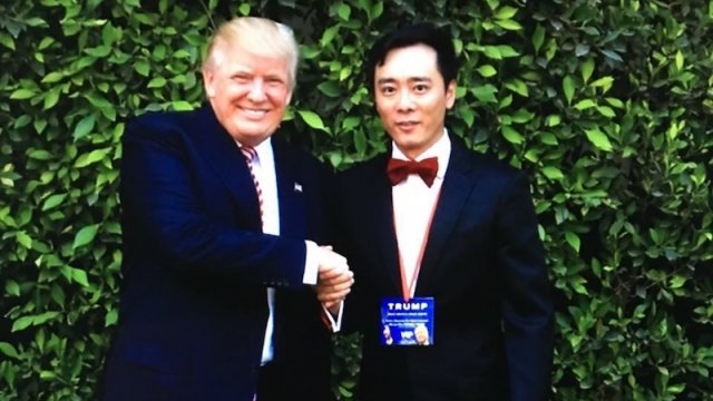 Chinese Americans For Trumps posing for a photo with Donald Trump
