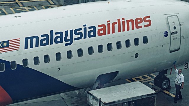 Cargo is loaded onto a Malaysia Airlines plane