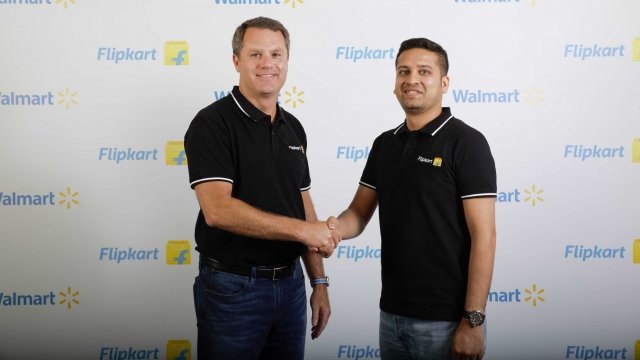 Walmart, Flipkart CEOs shake hands