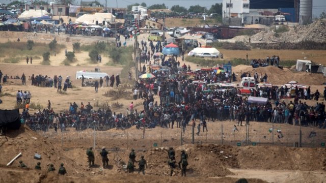 Thousands of Palestinians protest along its border with Israel