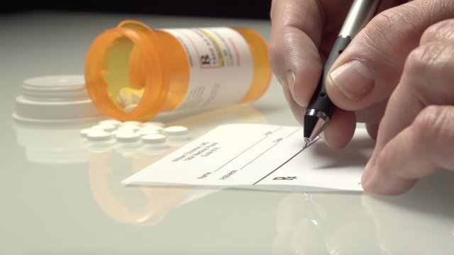 A doctor writing a prescription