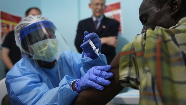 Health worker administers a vaccine