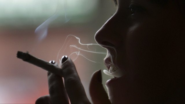 A woman smoking marijuana