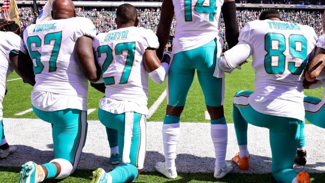 Players kneel during the national anthem prior to an NFL game.