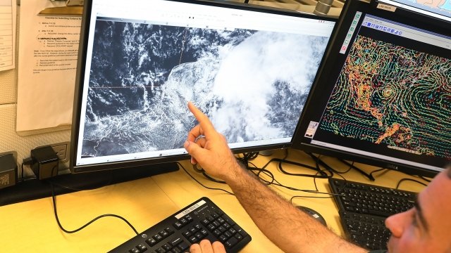 National Hurricane Center worker keeps track of storms