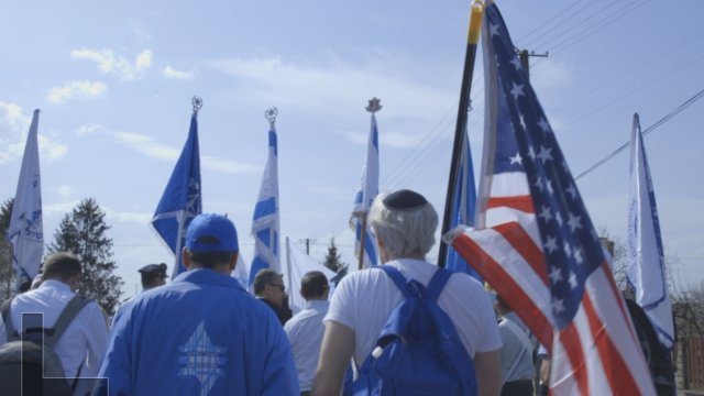 A group marches from Auschwitz to Birkenau extermination camp