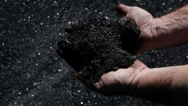 A miner handles coal in West Virginia
