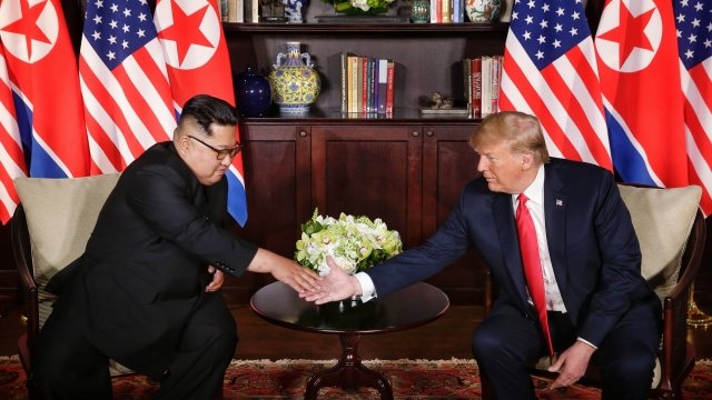 North Korean leader Kim Jong-un shakes hands with U.S. President Donald Trump.