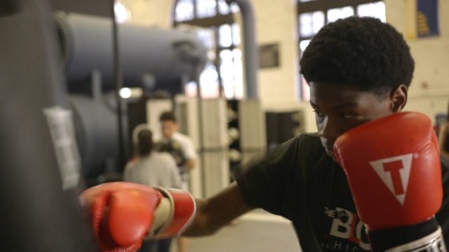 High School student Daishawn Wheeler punches a bag in an after school program called The Bloc.