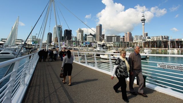 Sightseers take in the sights of the Viaduct Basin in Auckland, New Zealand.