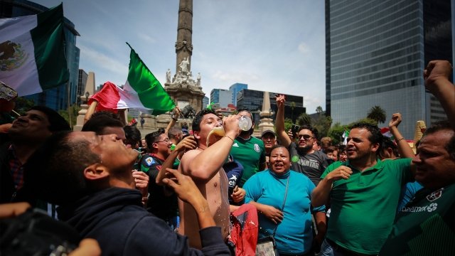 Mexican soccer fans celebrate a World Cup group stage win over Germany in Mexico City