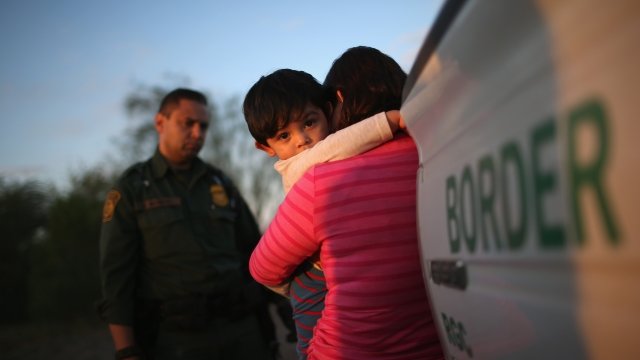 A migrant and her son at the border