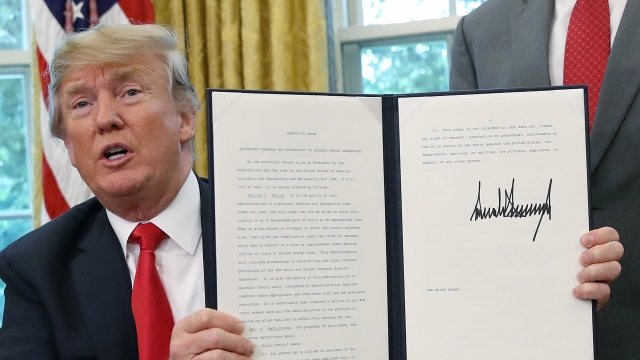Donald Trump holds signed executive order