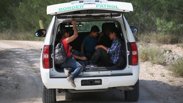 Unaccompanied minors in the back of a U.S. Border Patrol vehicle