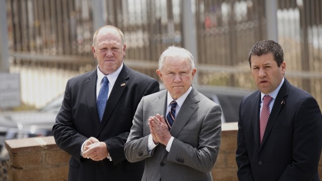 Jeff Sessions and two security agents.