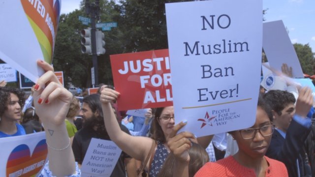 Protesters outside the Supreme Court after justices upheld the president's travel ban