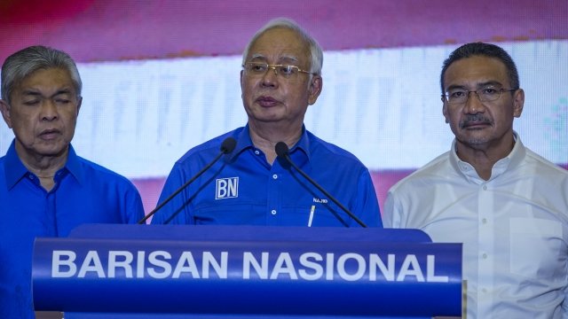 Former Malaysian Prime Minister Najib Razak stands at a podium