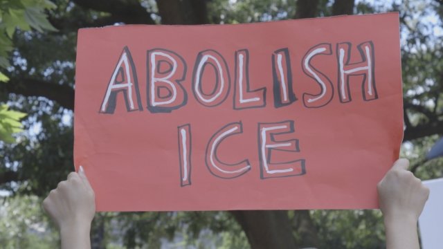 An "Abolish ICE" sign at an immigration rally.