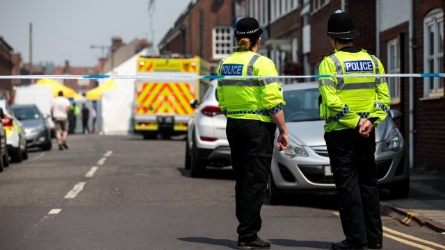 Police officers investigating the poisonings of a couple in the UK