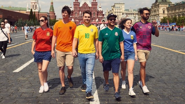 Six protesters smuggled the Pride flag in Russia by wearing their countries football jerseys.