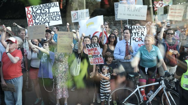 Protesters seen before President Trump's arrival in the UK.