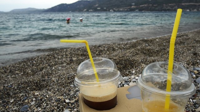 Plastic cups on a beach near Athens, Greece