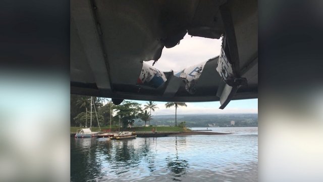 A hole in a Hawaii tour boat from a "lava bomb"
