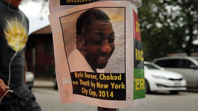 A flyer with a picture of Eric Garner is seen.