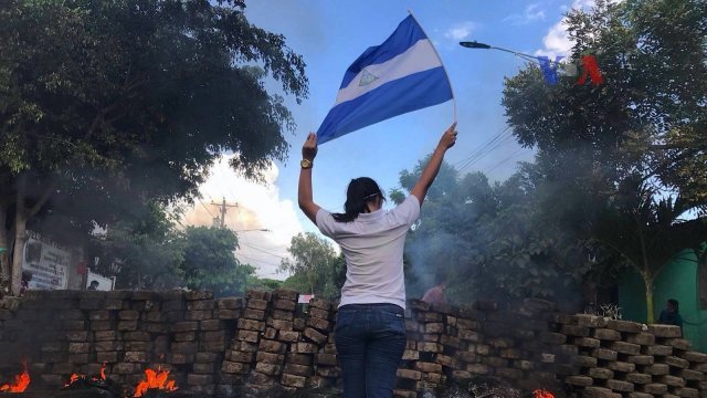 Woman holds Nicaraguan flag