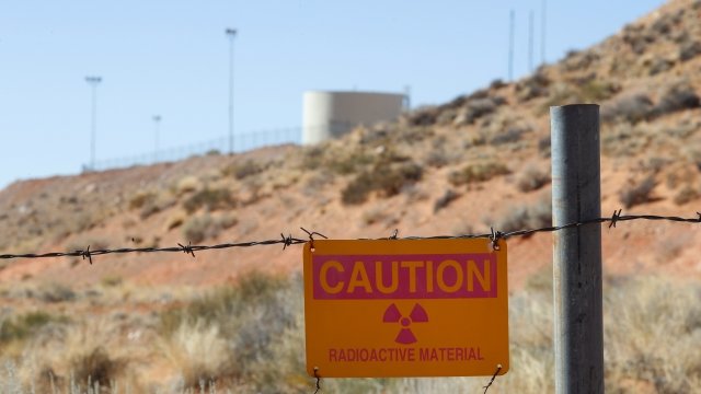 A radioactive warning sign hangs on fencing around the Anfield's Shootaring Canyon Uranium Mill.