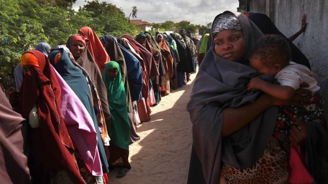 Somalis wait in line at a hospital