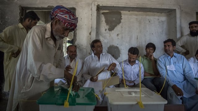 A Pakistani man heads to the polls