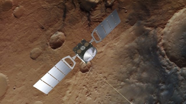 Artist's impression of Mars Express floating over an actual photo of Mars