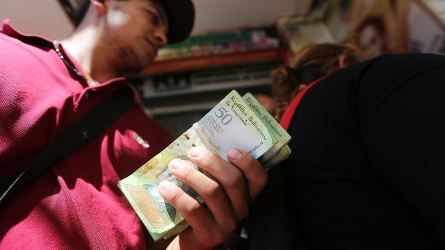 A Venezuelan man waits to exchange bolivars