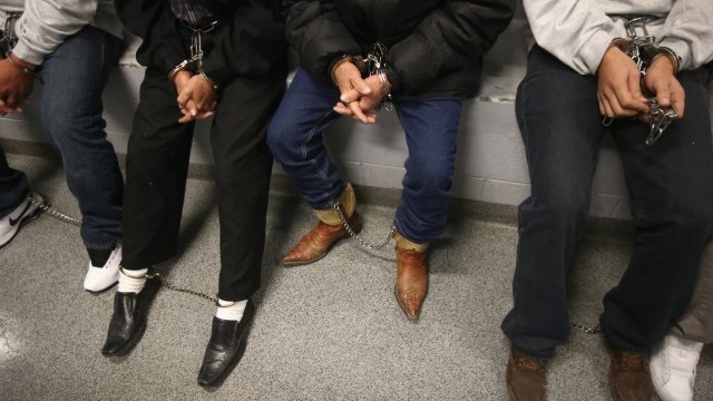 Handcuffed immigrants