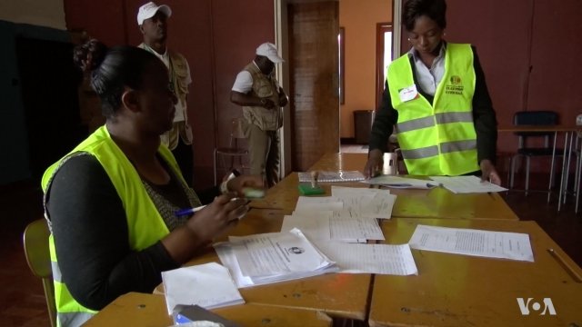 Zimbabwe election officials at polling location