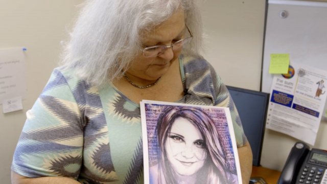 Susan Bro with a picture of her daughter Heather Heyer