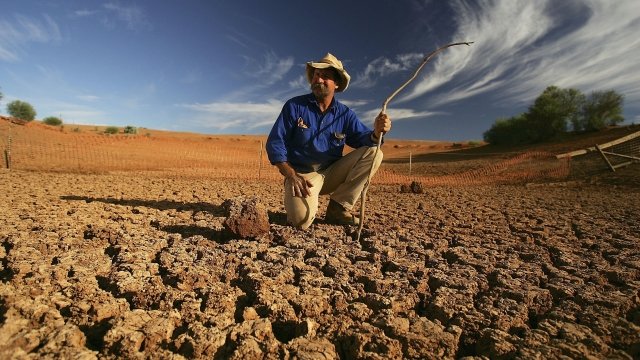 Australian farmer surveys dried up land