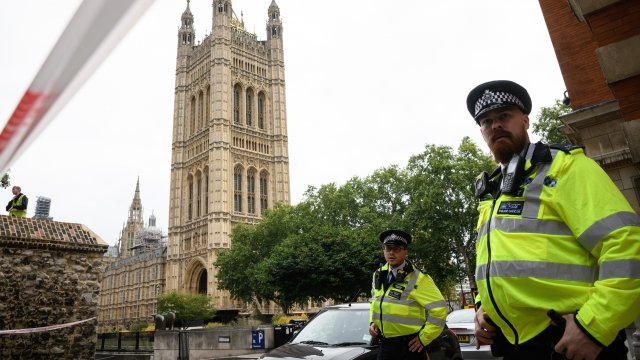 A London police officer stands outside the Palace of Westminster