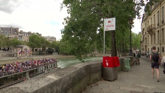 One of Paris's new open-air urinals sits on the waterfront.