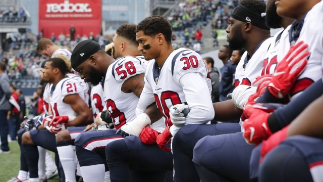 Football players kneeling during the national anthem